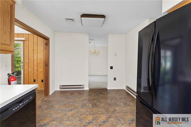 747 Marlton Rd Unit 747A, Monroe, NJ 08831 - kitchen featuring black appliances, a baseboard heating unit, dark stone finish flooring, light countertops, and a chandelier