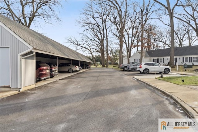 view of street with a residential view and curbs