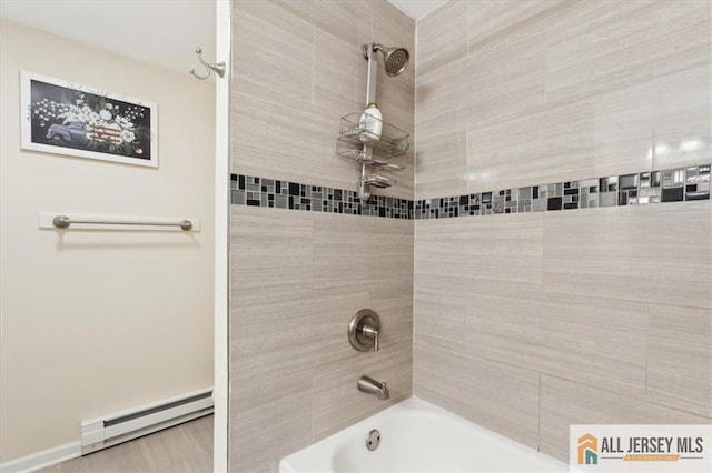 bathroom with a baseboard radiator and shower / bathtub combination