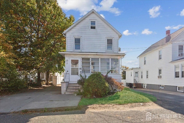 view of property with a sunroom