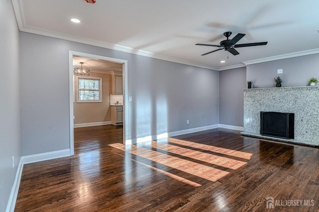 unfurnished living room with dark hardwood / wood-style flooring and ornamental molding