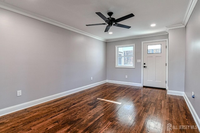 foyer with dark hardwood / wood-style floors, ceiling fan, and crown molding