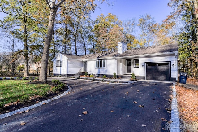 single story home featuring a garage