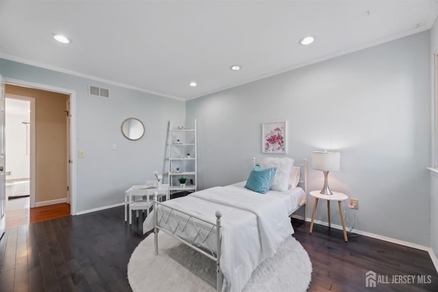 bedroom featuring ornamental molding and dark wood-type flooring