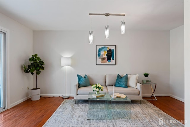 sitting room with hardwood / wood-style flooring