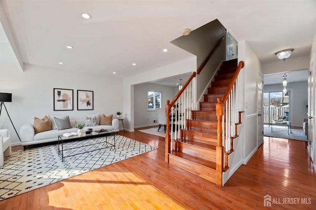 living room featuring wood-type flooring and plenty of natural light