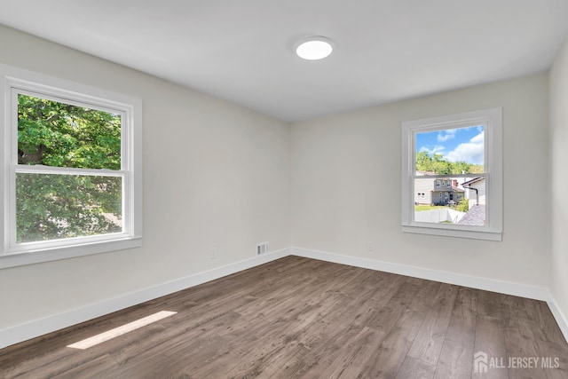 18 Heritage Dr, Edison, NJ 08820 - unfurnished room featuring plenty of natural light, wood finished floors, and baseboards