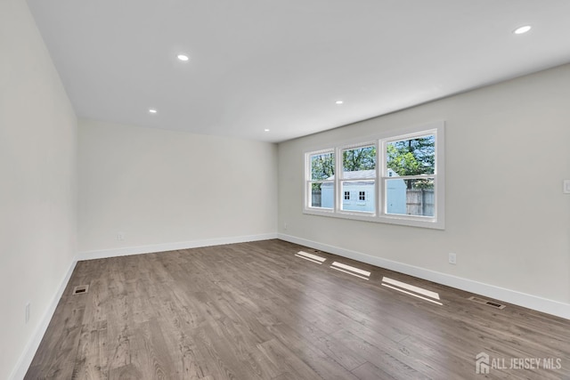 18 Heritage Dr, Edison, NJ 08820 - empty room with wood finished floors, baseboards, and recessed lighting