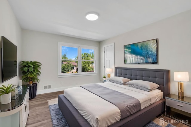 18 Heritage Dr, Edison, NJ 08820 - bedroom with baseboards and light wood-type flooring
