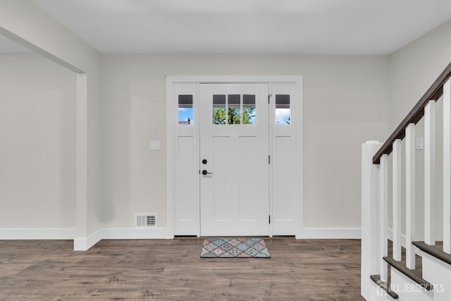 18 Heritage Dr, Edison, NJ 08820 - foyer with wood finished floors, baseboards, and stairway