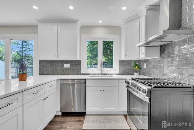 18 Heritage Dr, Edison, NJ 08820 - kitchen with stainless steel appliances, wall chimney range hood, healthy amount of natural light, white cabinetry, and recessed lighting