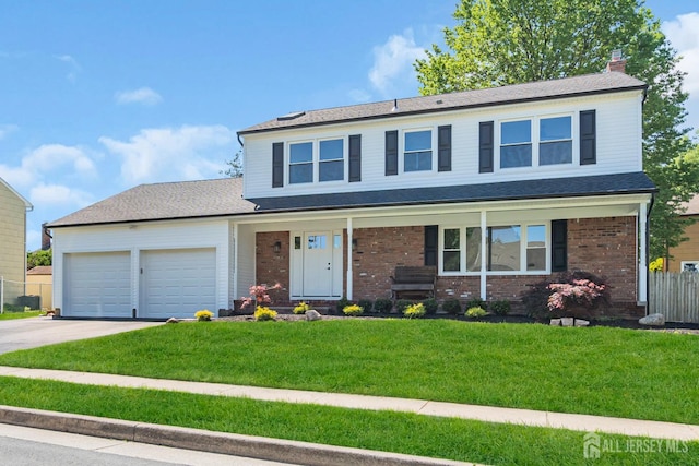 18 Heritage Dr, Edison, NJ 08820 - view of front of property with driveway, a garage, brick siding, a chimney, and a porch