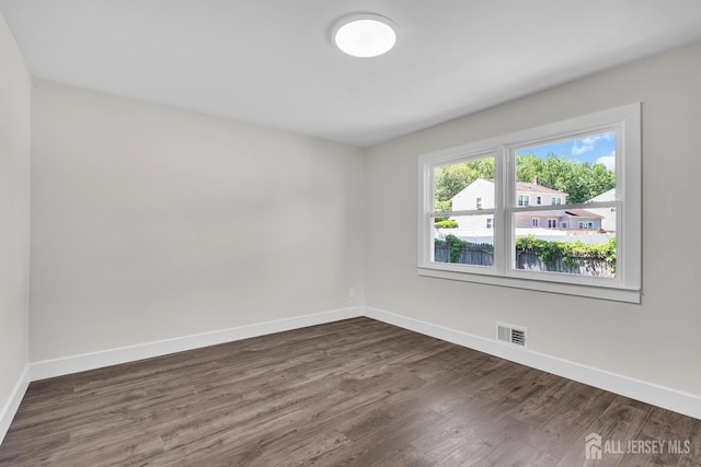 18 Heritage Dr, Edison, NJ 08820 - spare room featuring baseboards and dark wood-style floors