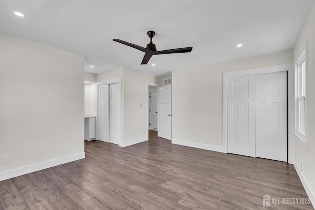 18 Heritage Dr, Edison, NJ 08820 - unfurnished bedroom featuring multiple closets, wood finished floors, baseboards, recessed lighting, and a ceiling fan