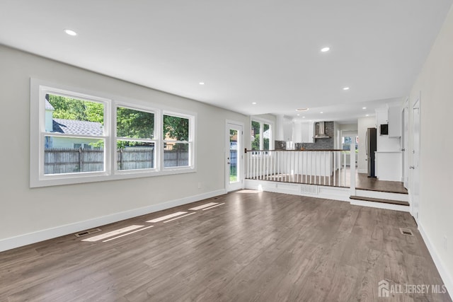 18 Heritage Dr, Edison, NJ 08820 - unfurnished living room featuring baseboards, wood finished floors, and recessed lighting