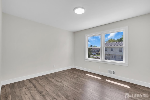 18 Heritage Dr, Edison, NJ 08820 - empty room with baseboards and dark wood-type flooring
