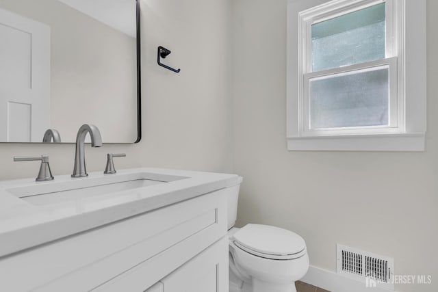 18 Heritage Dr, Edison, NJ 08820 - bathroom featuring vanity, toilet, and baseboards