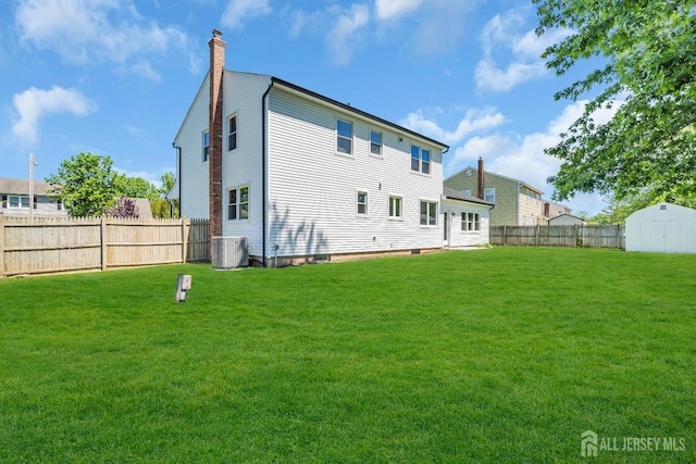 18 Heritage Dr, Edison, NJ 08820 - rear view of property featuring a chimney and central AC