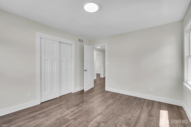 18 Heritage Dr, Edison, NJ 08820 - unfurnished bedroom featuring baseboards, wood finished floors, and a closet