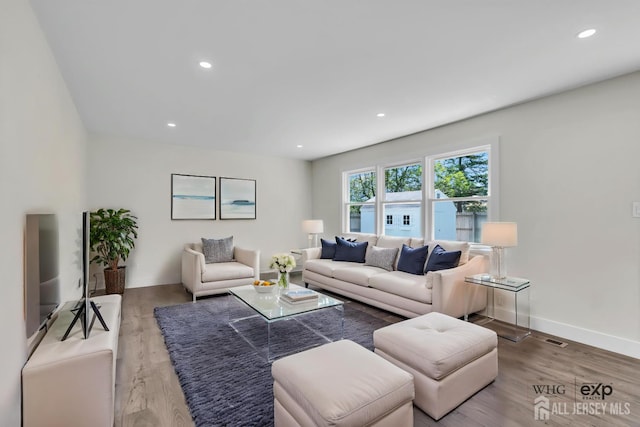 18 Heritage Dr, Edison, NJ 08820 - living area with wood finished floors, recessed lighting, and baseboards