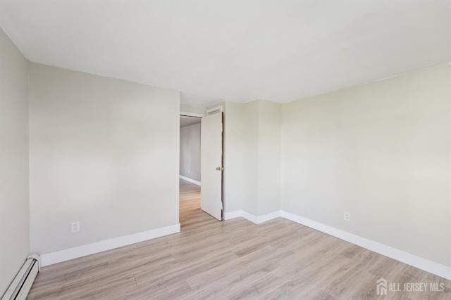 114 Pine Island Ter, Old Bridge, NJ 07735 - unfurnished room featuring baseboard heating, wood finished floors, and baseboards