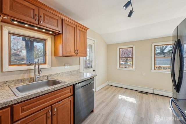 114 Pine Island Ter, Old Bridge, NJ 07735 - kitchen with dishwasher, a sink, vaulted ceiling, light countertops, and light wood-type flooring
