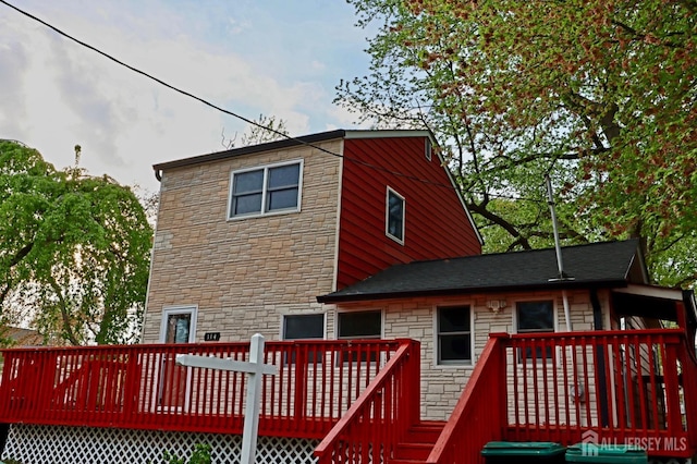 114 Pine Island Ter, Old Bridge, NJ 07735 - back of property featuring stone siding and a wooden deck