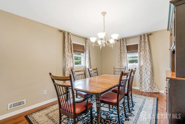 1010 Dorn Ave, Middlesex, NJ 08846 - dining area with a chandelier, plenty of natural light, baseboards, and light wood-style floors