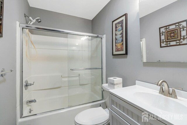 1010 Dorn Ave, Middlesex, NJ 08846 - bathroom with toilet, vanity, and enclosed tub / shower combo