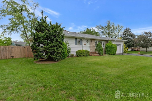 1010 Dorn Ave, Middlesex, NJ 08846 - view of front of home featuring a garage and asphalt driveway