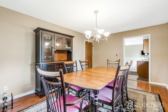 1010 Dorn Ave, Middlesex, NJ 08846 - dining room with a chandelier, light wood-type flooring, and baseboards