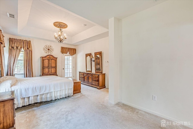 bedroom featuring visible vents, baseboards, an inviting chandelier, a raised ceiling, and light colored carpet