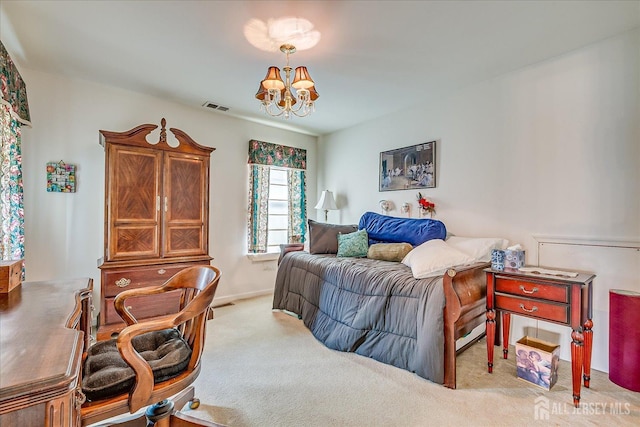 bedroom featuring visible vents, a notable chandelier, and carpet