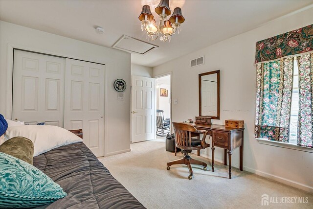 bedroom featuring light carpet, visible vents, baseboards, and a closet