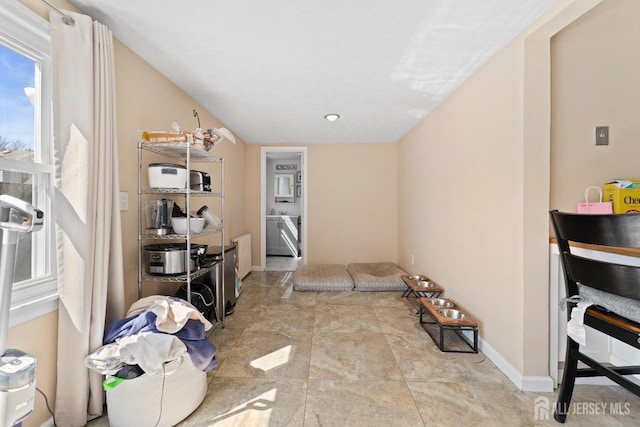 interior space featuring baseboards