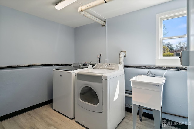 46 Hosford Ave, Leonardo, NJ 07737 - laundry room with washer and dryer and light wood-type flooring