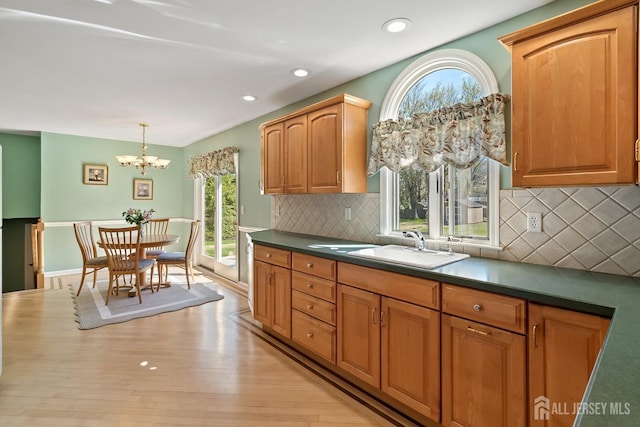 46 Hosford Ave, Leonardo, NJ 07737 - kitchen featuring healthy amount of natural light, a chandelier, a sink, dark countertops, and recessed lighting