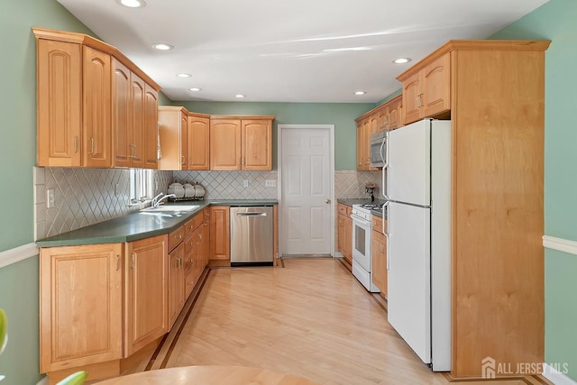 46 Hosford Ave, Leonardo, NJ 07737 - kitchen with appliances with stainless steel finishes, dark countertops, light wood-type flooring, recessed lighting, and decorative backsplash