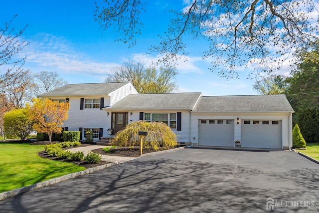 46 Hosford Ave, Leonardo, NJ 07737 - split level home featuring an attached garage, asphalt driveway, and a front lawn