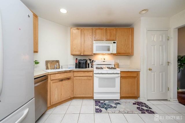 31 Capica Ct Unit 79, Old Bridge, NJ 08879 - kitchen with white appliances, light countertops, light tile patterned floors, recessed lighting, and light brown cabinetry