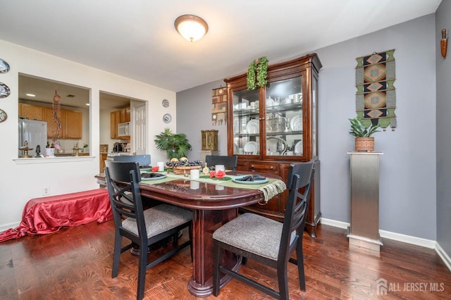 31 Capica Ct Unit 79, Old Bridge, NJ 08879 - dining space featuring dark wood finished floors and baseboards