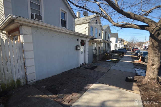 view of home's exterior featuring stucco siding and a residential view