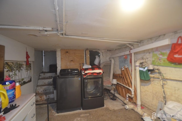 basement with washer and clothes dryer