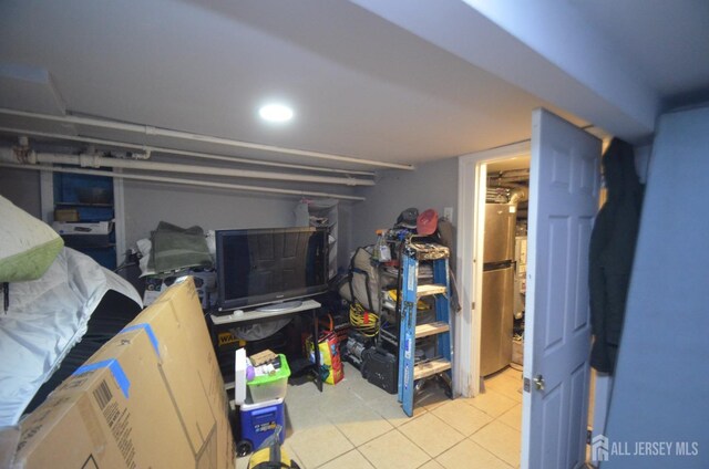 basement with light tile patterned floors