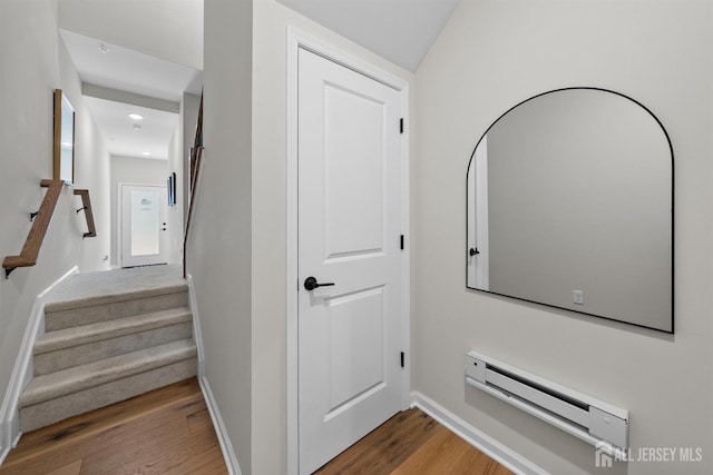 1306 Parker Blvd, West Windsor, NJ 08550 - hallway with baseboard heating, wood finished floors, stairs, and recessed lighting