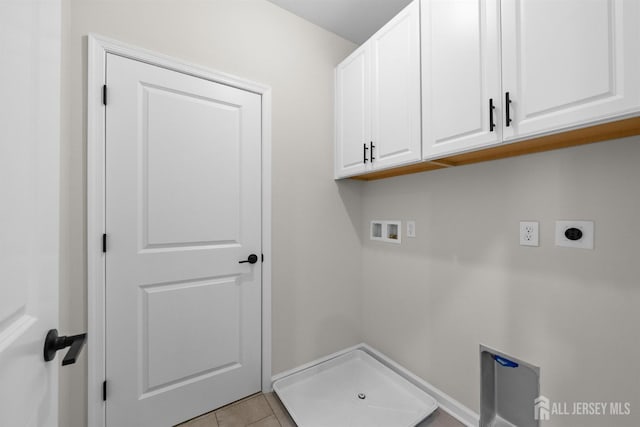 1306 Parker Blvd, West Windsor, NJ 08550 - laundry area featuring cabinet space, electric dryer hookup, hookup for a washing machine, and light tile patterned floors