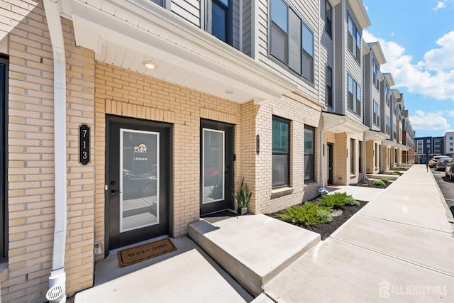 1306 Parker Blvd, West Windsor, NJ 08550 - doorway to property featuring brick siding and a residential view