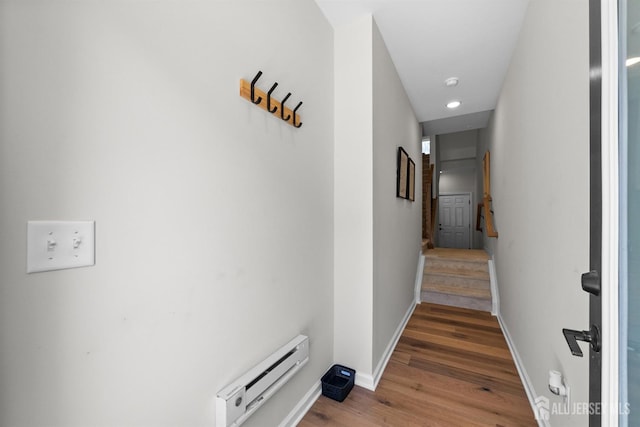 1306 Parker Blvd, West Windsor, NJ 08550 - hall with baseboard heating, wood finished floors, stairway, and recessed lighting