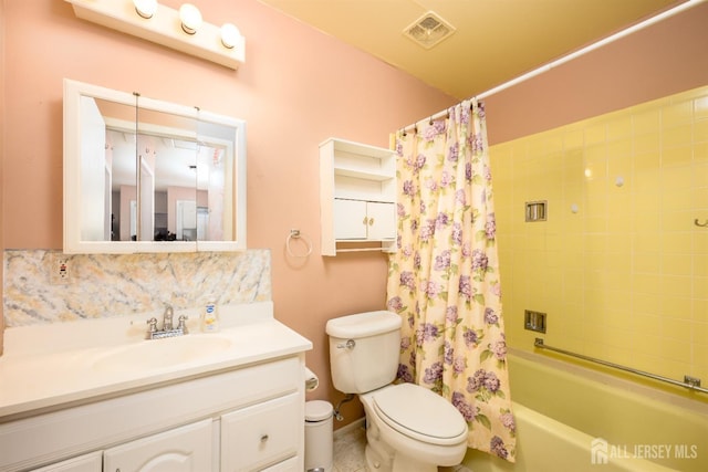 full bathroom featuring vanity, shower / bath combination with curtain, and toilet