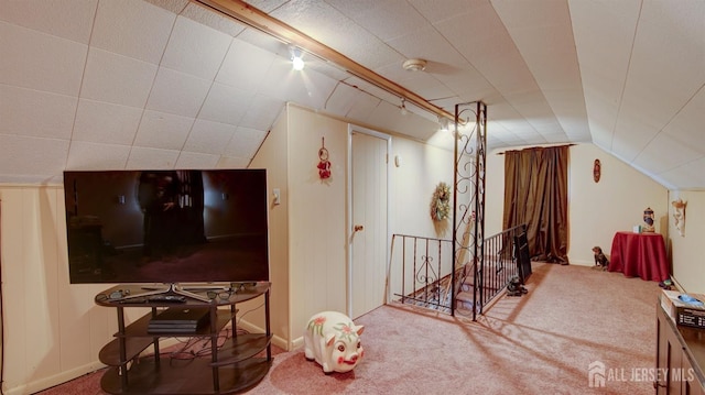 additional living space with carpet floors and lofted ceiling